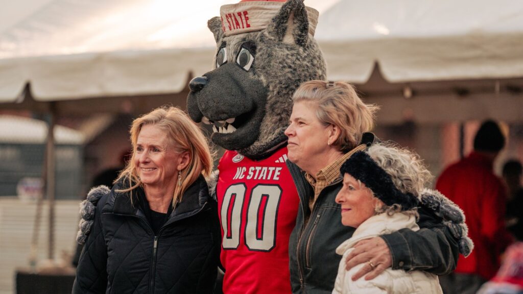 friends posing with Mr. Wuf